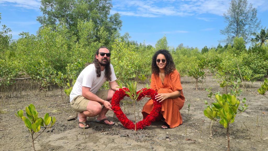 Couple planting a tree