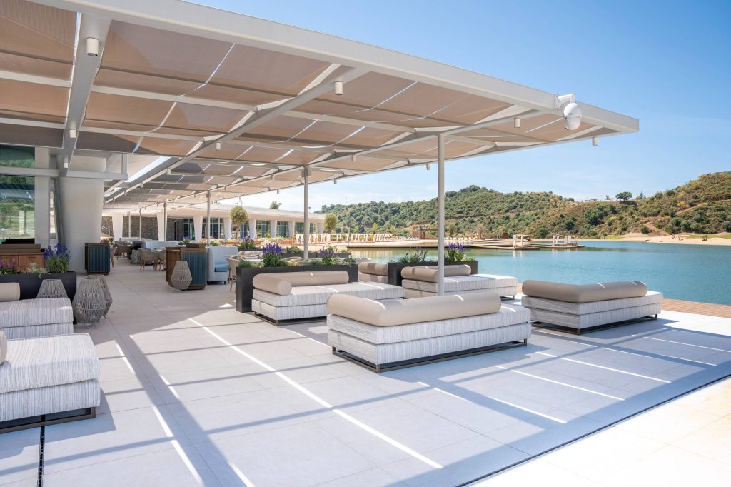 View of the shaded terrace of Saltao Marbella looking towards the lake and the hills beyond